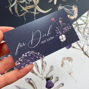 May include: A dark blue card with a floral design and the text "f&uuml;r Dich mit Liebe" in white calligraphy.