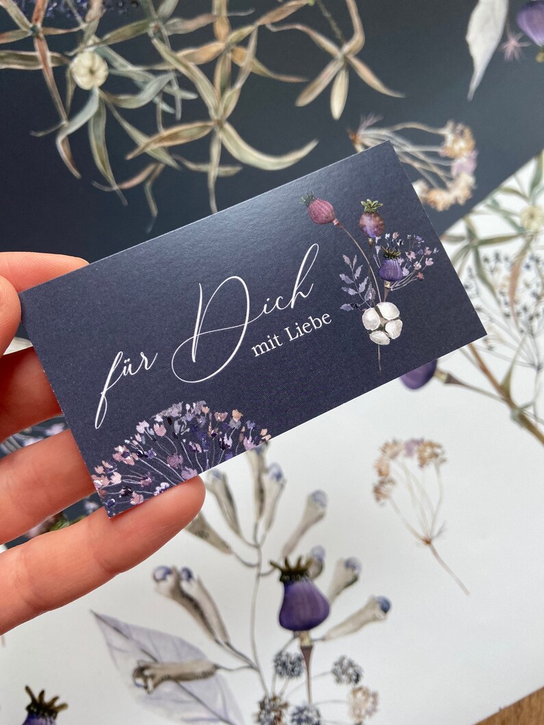 May include: A dark blue card with a floral design and the text "f&uuml;r Dich mit Liebe" in white calligraphy.
