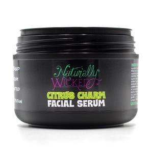 Naturally Wicked Citrus Charm Facial Serum jar with lid removed, ready to use.