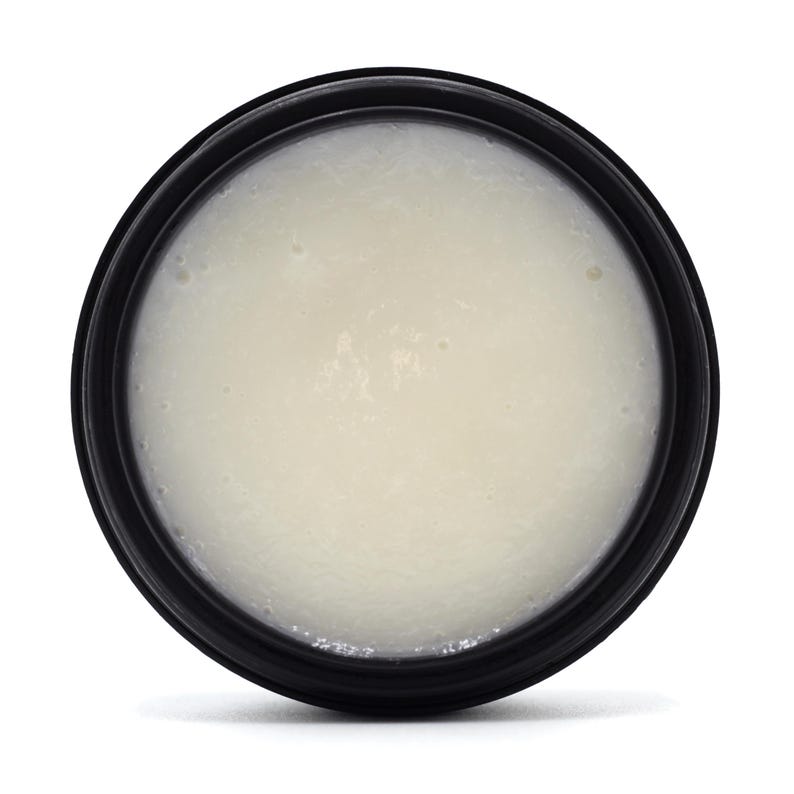 Top view of Naturally Wicked Citrus Charm Facial Serum, showing smooth, creamy texture.