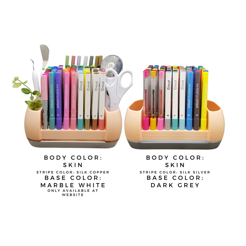 May include: Two pen holders in a skin tone colour, each filled with colourful markers and pens. One has a marble white base and the other a dark grey base. The text on the image says "BODY COLOUR: SKIN" and "STRIPE COLOUR: SILK COPPER" and "SILK SILVER".