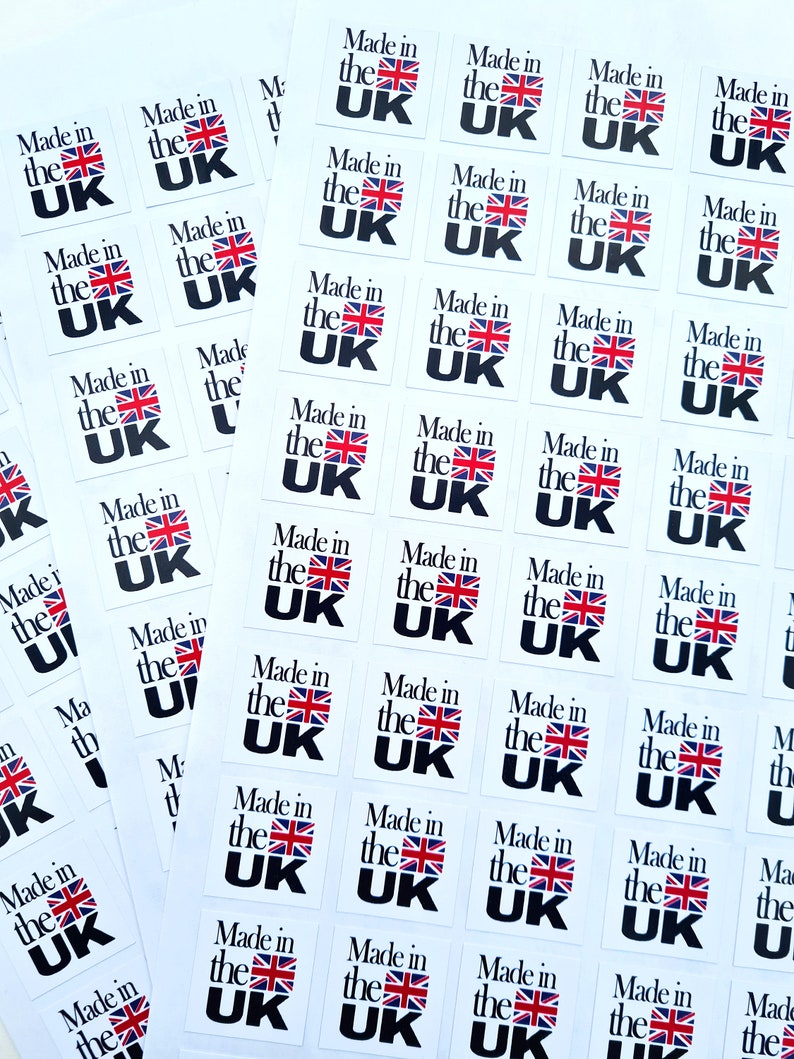 May include: A sheet of white paper with multiple stickers that say "Made in the UK" in black text with a red, white, and blue UK flag.