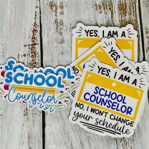 May include: A set of four yellow and white stickers with the text "YES, I AM A SCHOOL COUNSELOR" and "NO, I WON'T CHANGE YOUR SCHEDULE".