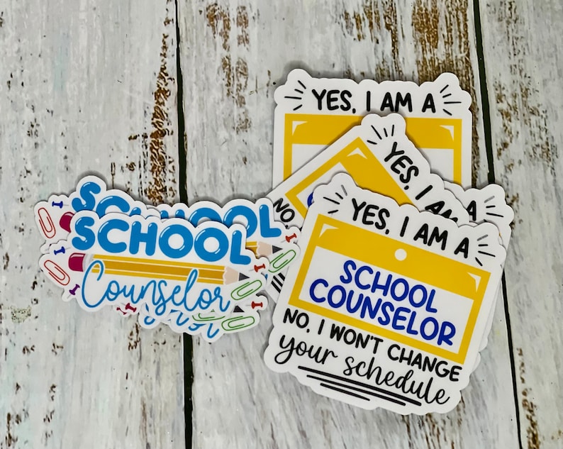 May include: A set of four yellow and white stickers with the text "YES, I AM A SCHOOL COUNSELOR" and "NO, I WON'T CHANGE YOUR SCHEDULE".