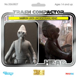 May include: A grey Nabrun Leids (Morseerian) Head action figure from the Trash Compactor series. The figure features a distinctive design with a cone-shaped head, large eyes, and a breathing apparatus. The packaging includes the text "Vintage" and "Notatoy."
