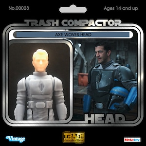 May include: A vintage-style action figure package featuring a light gray action figure and a man in a dark gray and blue outfit. The package has the text "TRASH COMPACTOR" and "AXE WOVES HEAD". The figure is labeled "HEAD".