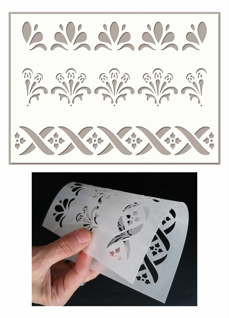 May include: A white plastic stencil featuring three different designs. The top design is a row of five simple floral shapes. The middle design is a row of five more elaborate floral shapes. The bottom design is a repeating pattern of interlacing lines with small floral shapes.
