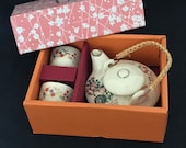 Satsuma miniature tea pot with wicker handle and two cups