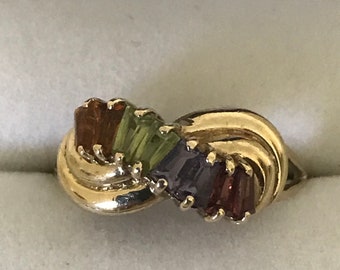 Anillo de vestir baguette de oro con múltiples piedras