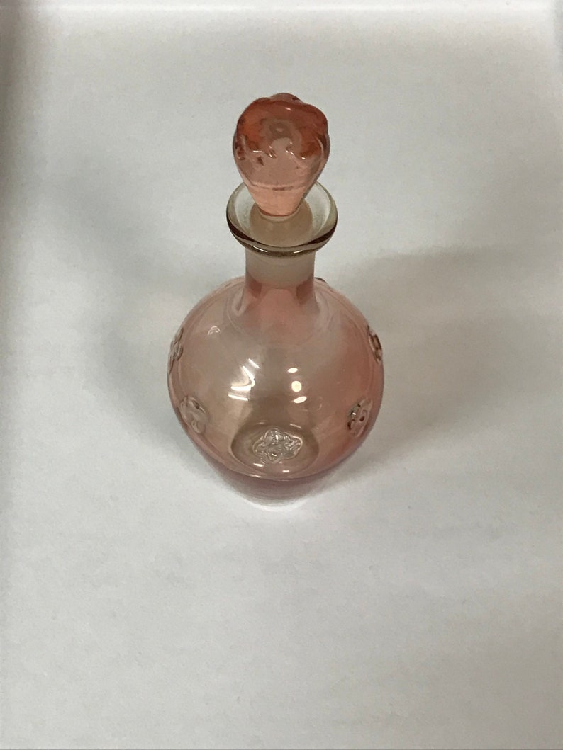Delicate pink glass bottle with stopper