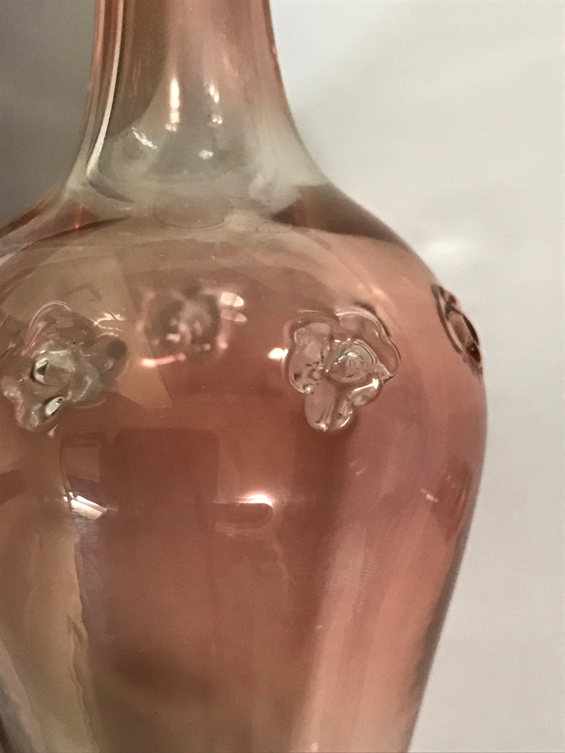 Delicate pink glass bottle with stopper