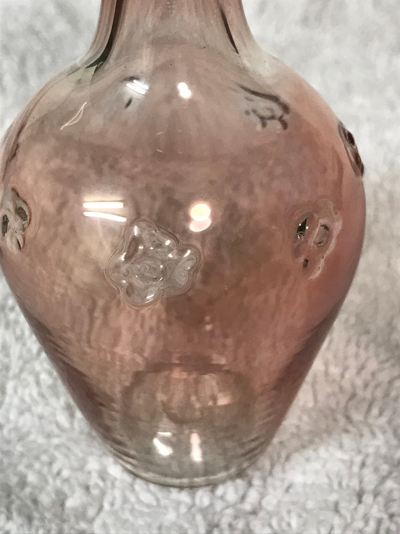 Delicate pink glass bottle with stopper