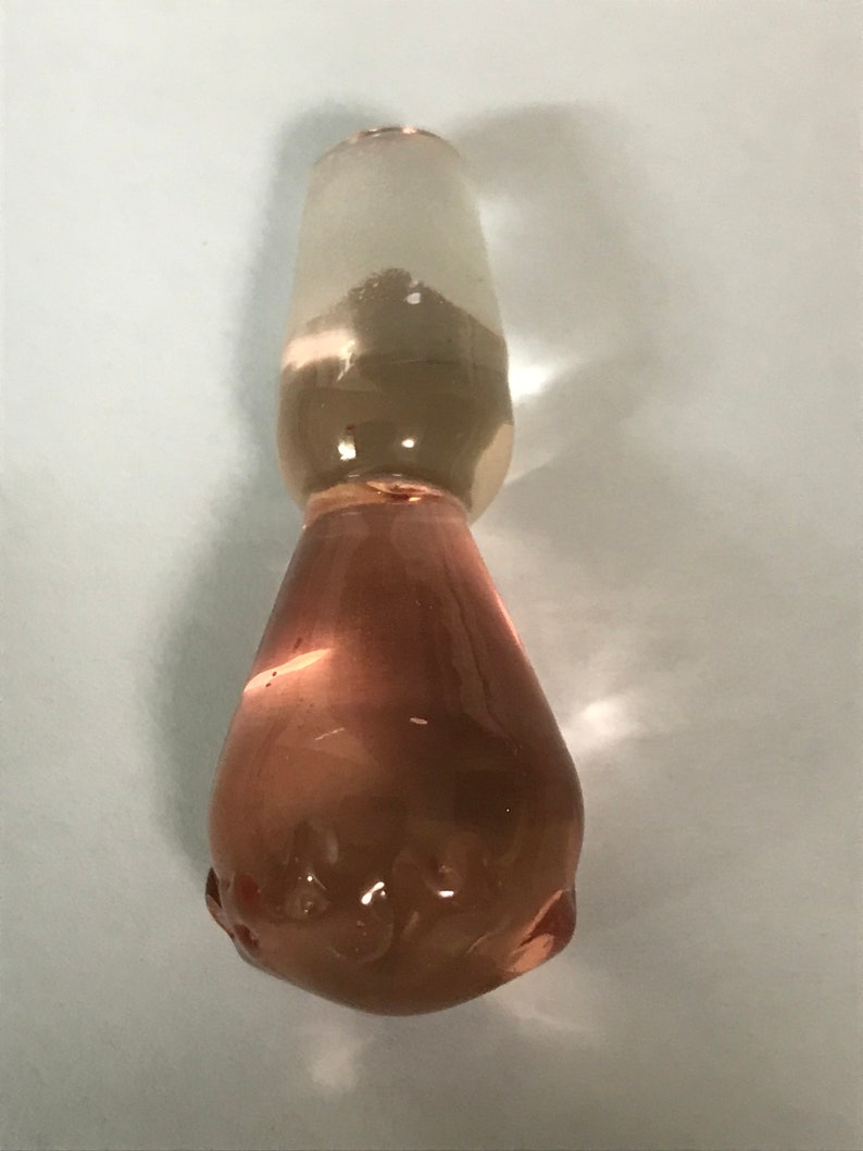 Delicate pink glass bottle with stopper