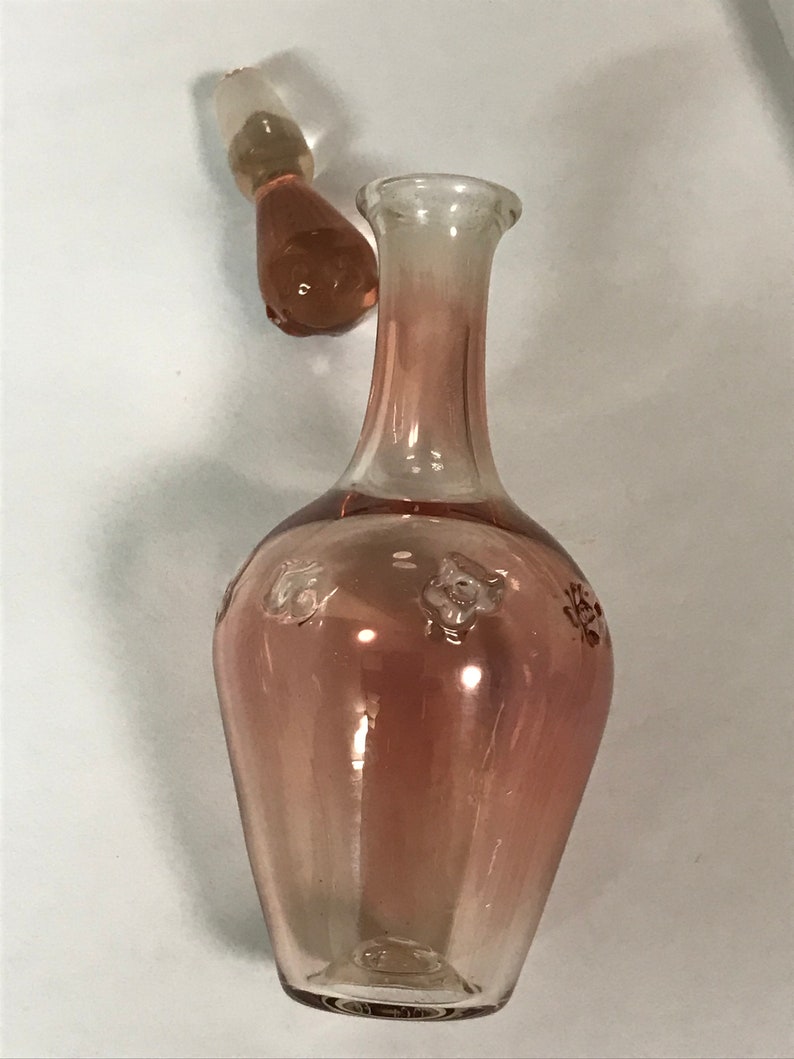 Delicate pink glass bottle with stopper