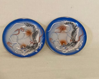 Pair of Japanese dragon ware moriage saucers