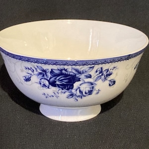 Chinese fine porcelain footed rice bowl with blue floral pattern