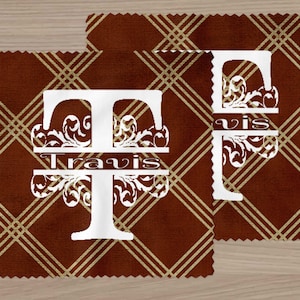 May include: Two brown and gold patterned fabric squares with white monogrammed initials. The first square has the letter "T" with the name "Travis" centered below the letter. The second square has the letter "F" with the name "Vis" centered below the letter.