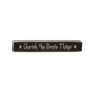 May include: Black wooden sign with white stars and the text "Cherish the Simple Things" in white cursive lettering.