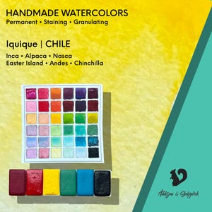 May include: A set of handmade watercolors featuring a grid of thirty-five small paint squares in various colors. Below the grid are six larger rectangular paint pans in red, yellow, green, blue, and black. Text includes HANDMADE WATERCOLORS.