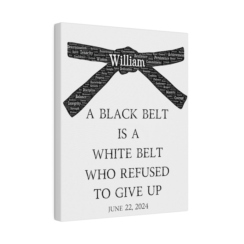 May include: A white canvas print with a black belt made of words. The belt is tied in a knot and the words are related to martial arts. The text below the belt reads "A black belt is a white belt who refused to give up." The date June 22, 2024 is printed below the text.