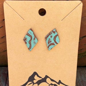 Embossed diamond shaped leather earrings with stainless post