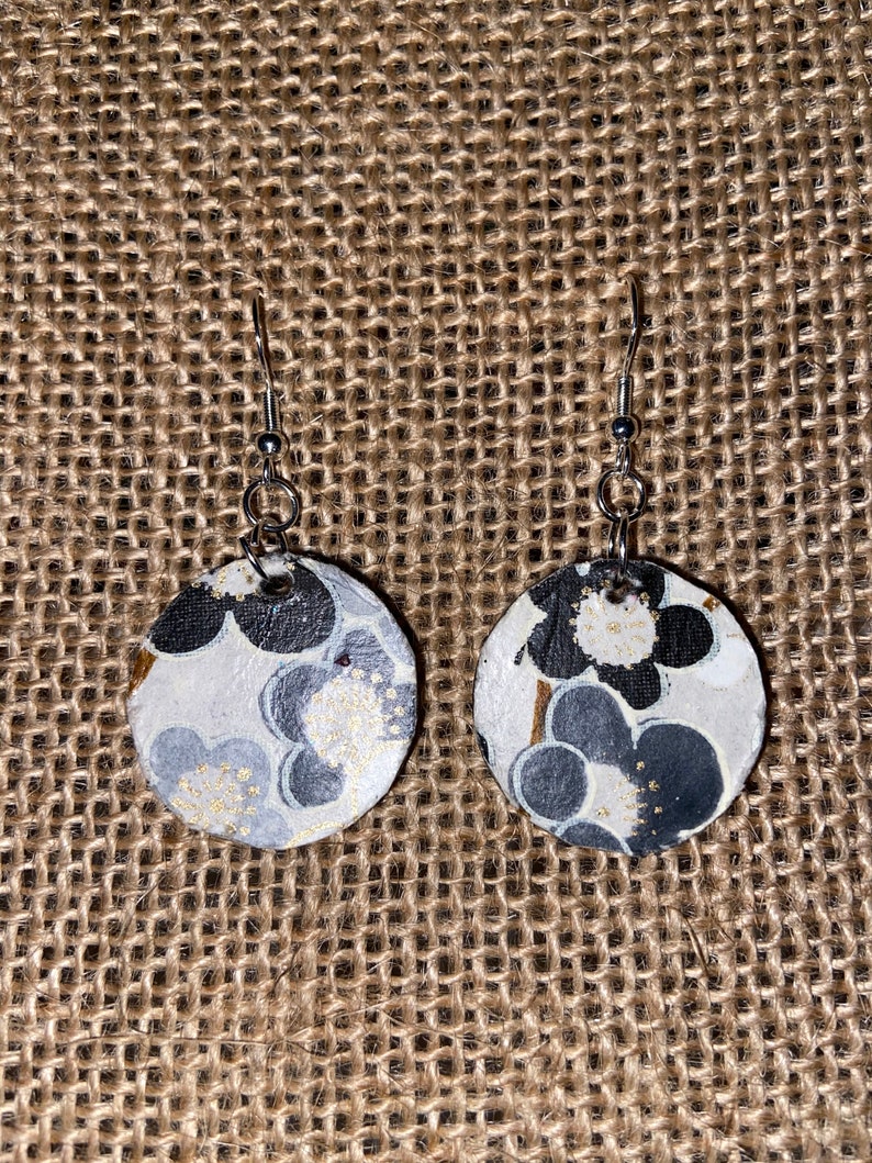 Black painted small wooden circles with fun Italian paper.