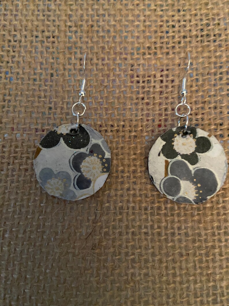 Black painted small wooden circles with fun Italian paper.