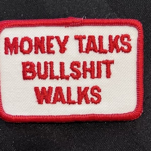 May include: Red embroidered patch with a white background and the text "MONEY TALKS BULLSHIT WALKS".