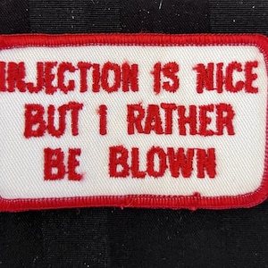 May include: Red embroidered patch with white background. The text reads "Injection is nice but I rather be blown."