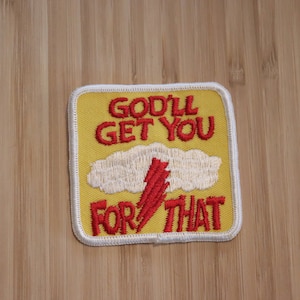 May include: Yellow embroidered patch with white trim. The patch features a red lightning bolt and a white cloud with the text "God'll Get You For That".
