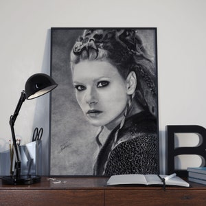Portrait of Lagertha, featuring a hyper-realistic charcoal drawing of Katheryn Winnick printed on high-quality white satin paper