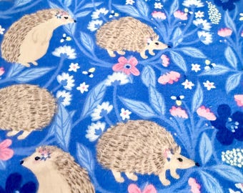 blue flannel fabric, hedgehogs and flowers, pink and blues