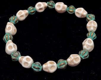 Antique-Style Skull and Metal Bead Bracelet