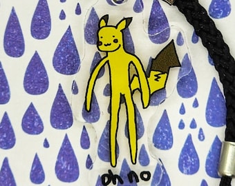 May include: A yellow cartoon character with a tail, resembling Pikachu, is drawn on a clear plastic charm. The charm is attached to a black lanyard with a silver clasp. The charm has the words "oh no" written on it.
