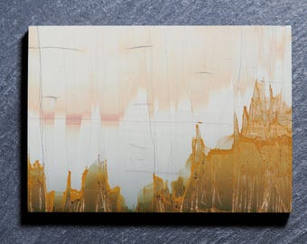 May include: A rectangular slab of polished stone featuring a natural landscape pattern. The surface displays a creamy white and pale peach upper section with thin, dark vertical lines, transitioning into a jagged, deep golden-brown base.