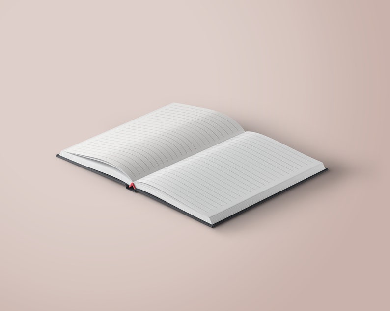 May include: An open notebook with lined pages and a black cover. The notebook is lying open on a light pink surface.