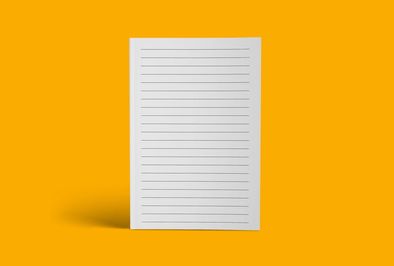 May include: A white lined notepad with a blank surface, standing upright on a yellow background.