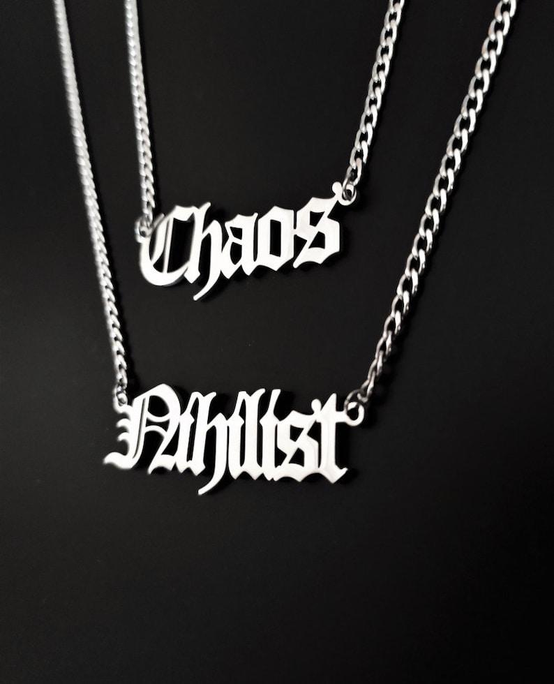 May include: Two silver necklaces with the words "Chaos" and "Philist" in a gothic font.