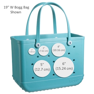 May include: A light blue Bogg Bag with a white label that says "bogg". The bag has four white circles with measurements in inches and centimeters. The bag has two handles.