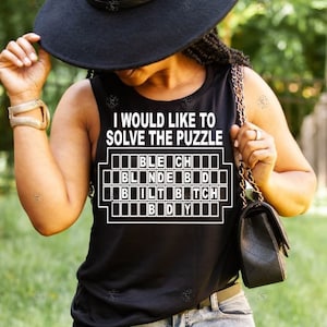 May include: Black tank top with the text "I would like to solve the puzzle" and a black and white crossword puzzle with the words "BLECH", "BLNDE BD", "BILT BTCH", and "BDY".