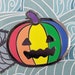Gil Caudill reviewed Queer-o-Lantern (LGBTQIA+ pride) hard enamel pin