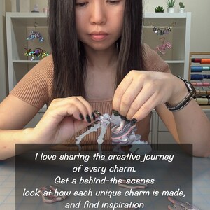 May include: A multi-colored, layered, 3D-printed dinosaur charm being assembled. The text reads: I love sharing the creative journey of every charm. Get a behind-the-scenes look at how each unique charm is made, and find inspiration from previous custom orders. Join me on... lorraine_spectrumlab, Lorraine Liang Chandler, Spectrum Lab.