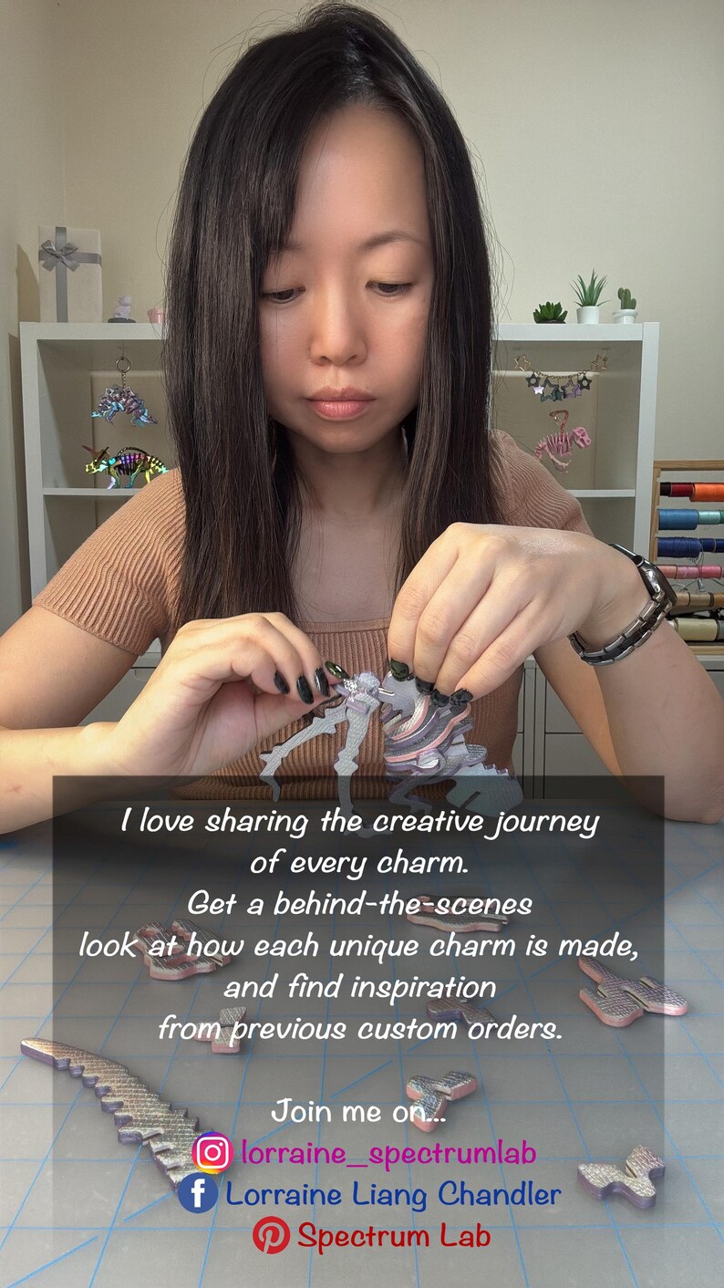 May include: A multi-colored, layered, 3D-printed dinosaur charm being assembled. The text reads: I love sharing the creative journey of every charm. Get a behind-the-scenes look at how each unique charm is made, and find inspiration from previous custom orders. Join me on... lorraine_spectrumlab, Lorraine Liang Chandler, Spectrum Lab.