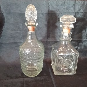 Two Vintage Clear Glass Decanters Both with Cork Stoppers - Dated about 1957 and 1964