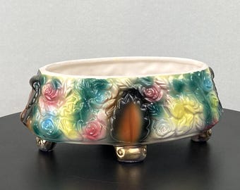 Small, ceramic, mulit-colored floral, footed planter/centerpiece