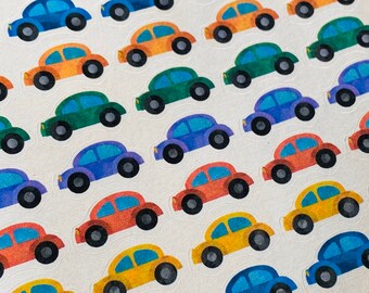 May include: A sheet of colorful car stickers with a variety of colors including blue, green, yellow, orange, and red. The stickers are arranged in rows and columns on a white background.