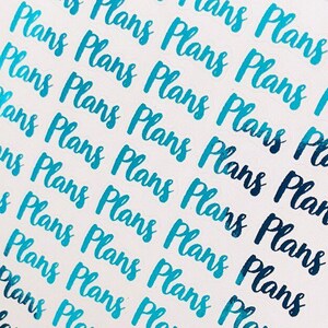 May include: A white sheet of paper with the word "Plans" repeated multiple times in a blue gradient font. The paper is held up by a yellow plastic clip.