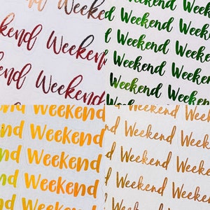 May include: A sheet of colourful stickers with the word "Weekend" written in different fonts and colours. The stickers are on a white background.