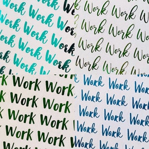 May include: A sheet of stickers with the word "Work" repeated in various colors, including green, blue, and teal. The stickers are arranged in rows and columns.