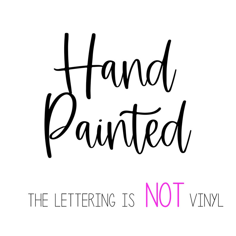 May include: Hand painted sign with the text "Hand Painted" in black cursive lettering. The text "THE LETTERING IS NOT VINYL" is written in white below the main text with the word "NOT" in pink.